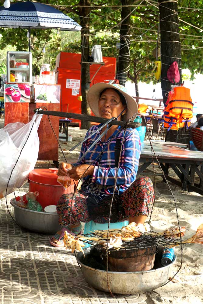A beach side vendor. Many local workers have struggled in the new Chinese-led economy. Photo: RFA