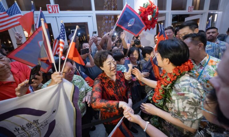 Taiwan’s President Lai Ching-te (C-R) is greeted by members of the local Taiwanese community at the Hyatt Regency in Tumon, Guam on Dec. 4, 2024.