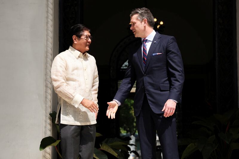 Philippine President Ferdinand Marcos Jr. meets with U.S. Defense Secretary Pete Hegseth at the Malacañang Palace in Manila, March 28, 2025.