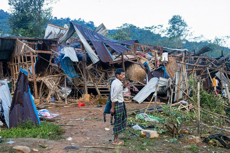 A man looks at homes destroyed after air and artillery strikes in Mung Lai Hkyet displacement camp, in Laiza, Myanmar, Oct. 10, 2023. (AP)