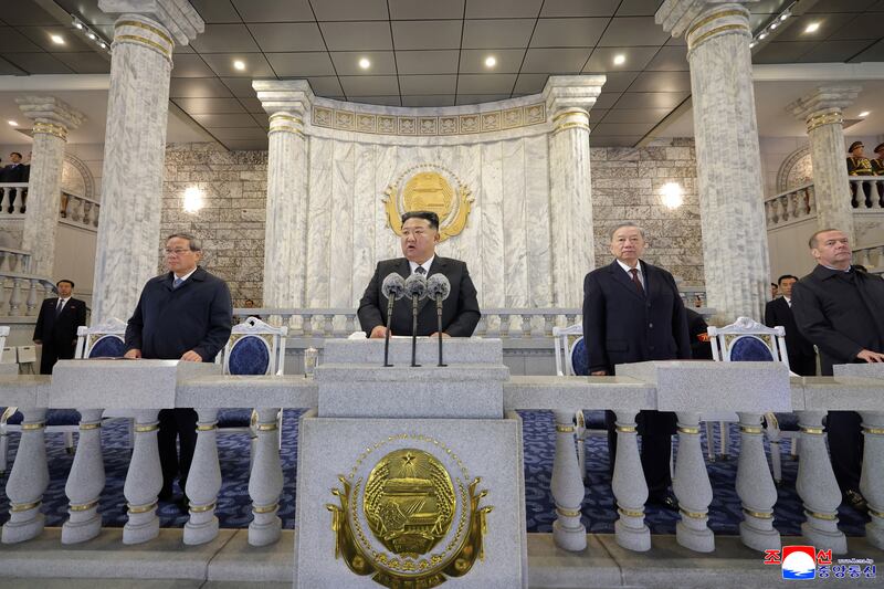 North Korean leader Kim Jong Un speaks alongside General Secretary of the Communist Party of Vietnam To Lam, Deputy Chairman of the Russian Security Council and leader of the United Russia political party Dmitry Medvedev and China’s Premier Li Qiang as they attend a military parade celebrating the 80th anniversary of the founding of the ruling Workers' Party of Korea at Kim Il Sung Square in Pyongyang in this image released October 11, 2025 by the North Korean government.