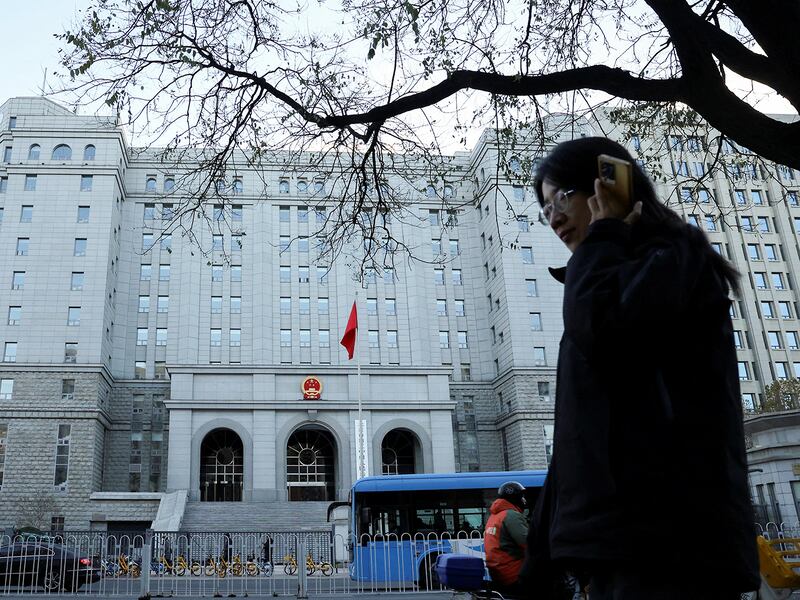 A pedestrian walks past Beijing No. 2 Intermediate People's Court, where former Chinese journalist Dong Yuyu received his verdict for espionage charges, in Beijing, Nov. 29, 2024.