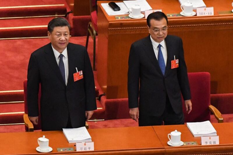 李克强总理在政府工作报告中指出,当前和今后一个时期,中国发展面临的风险挑战前所未有。(法新社)