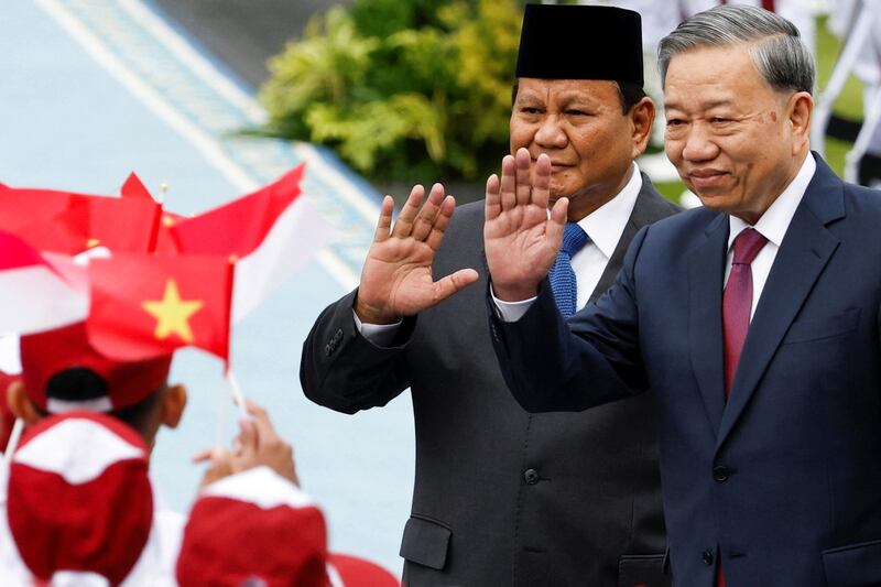 Indonesian President Prabowo Subianto (L) and Vietnam's Communist Party General Secretary To Lam inspect the guard of honor, during a welcoming ceremony, on the day of their meeting, at the Merdeka Palace in Jakarta, Indonesia, March 10, 2025.