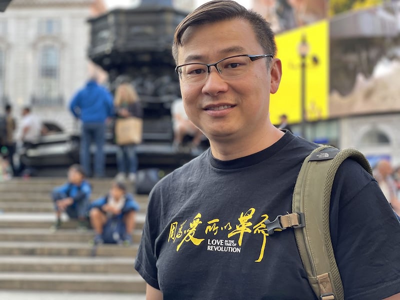 参与伦敦 “7·21”集会的港人梁先生，移民前任职警队以外的香港纪律部队。 （吕熙摄）