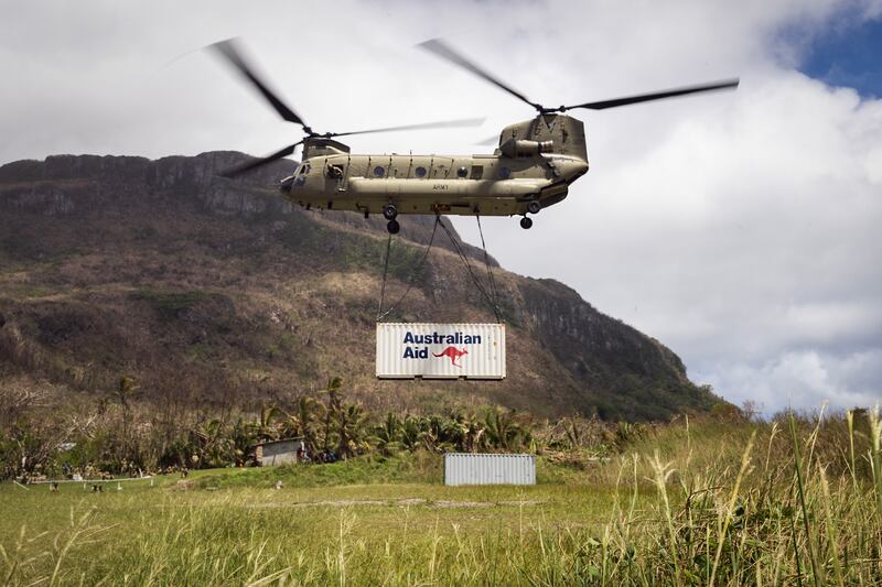An Australian Army CH-47 Chinook helicopter delivers aid to Futuna Island in Vanuatu, March 21, 2023, following destructive cyclones.