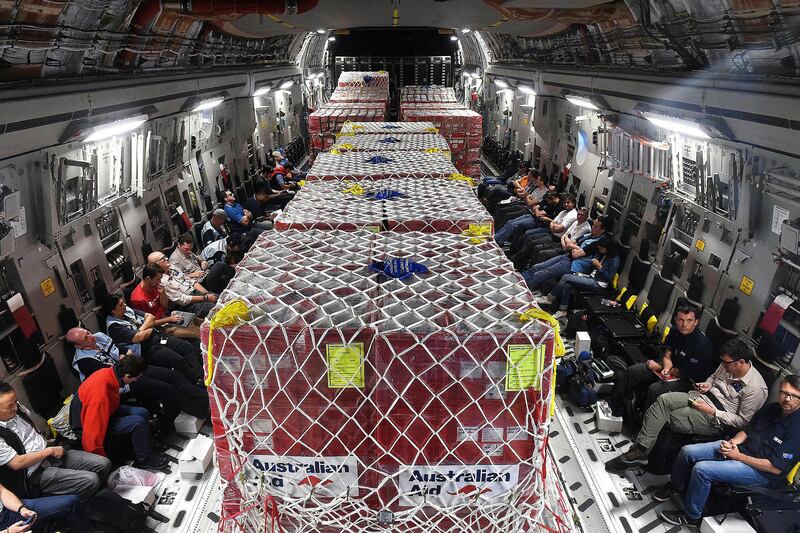 Australian defense force, emergency services personnel and relief supplies onboard an Australian Air Force C-17A Globemaster cargo plane en route Port Vila, Vanuatu, March 16, 2015.